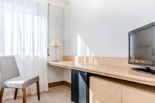 Habitación Triple del hotel Exe Campus. Foto 7