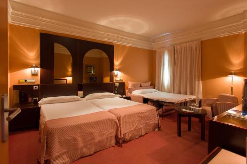 Habitación Doble con cama supletoria del hotel Soho Boutique Jerez. Foto 9