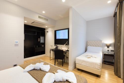 Habitación Triple Deluxe del hotel Floris. Foto 4