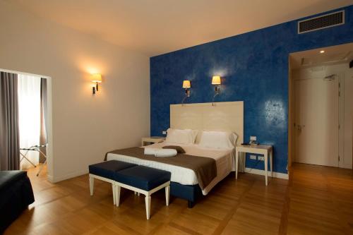 Habitación Cuádruple Deluxe del hotel Floris. Foto 1