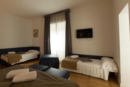 Habitación Cuádruple Deluxe del hotel Floris. Foto 10