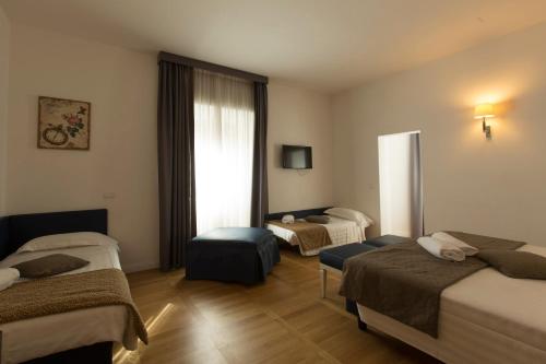 Habitación Cuádruple Deluxe del hotel Floris. Foto 15