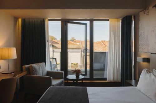 Habitación Doble Deluxe con balcón del hotel Timbre Heroismo. Foto 4