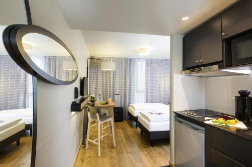 Estudio con 2 camas individuales del hotel Aparthotel Adagio Access La Défense Puteaux. Foto 8