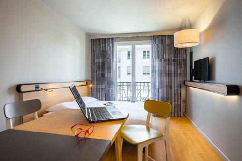 Estudio con balcón del hotel Aparthotel Adagio Access La Défense Puteaux. Foto 1