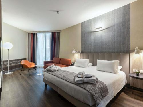 Habitación Privilege con balcón del hotel Mercure Firenze Centro. Foto 1