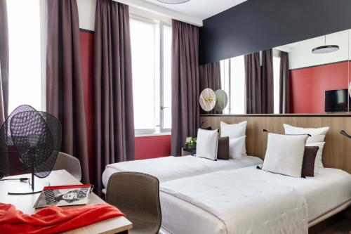 Habitación Clásica del hotel Opéra Liège. Foto 3