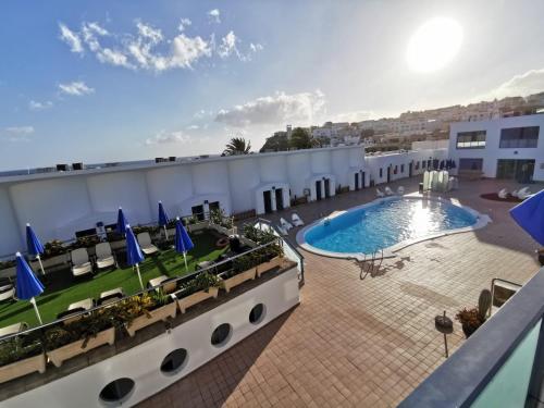 Apartamento con vistas a la piscina del hotel Igramar Morrojable - Adults Only. Foto 24