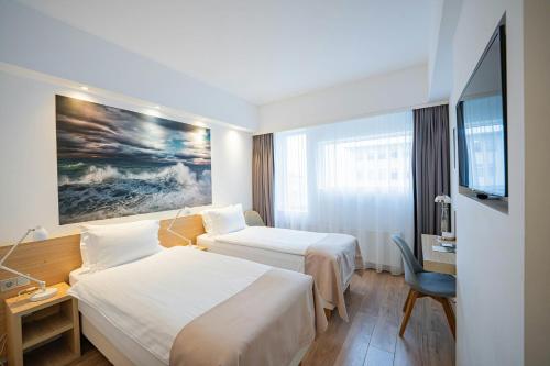 Habitación Doble Estándar - 2 camas del hotel Storm Hotel By Keahotels. Foto 1