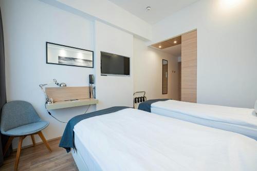 Habitación Doble Económica - 2 camas del hotel Storm Hotel By Keahotels. Foto 1
