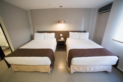 Habitación Doble - 2 camas dobles del hotel Ojos Del Rio. Foto 4