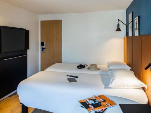 Habitación Doble Estándar - 2 camas del hotel Ibis Toulouse Ponts Jumeaux. Foto 4