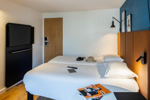 Habitación Doble Estándar - 2 camas del hotel Ibis Toulouse Ponts Jumeaux. Foto 6