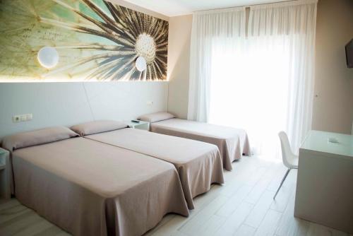 Habitación Doble con Cama supletoria del hotel Luz de Luna