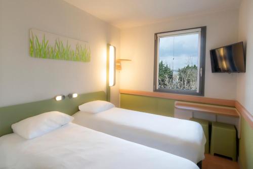 Habitación Doble con 2 camas individuales del hotel Ibis Budget Antwerpen Port. Foto 5