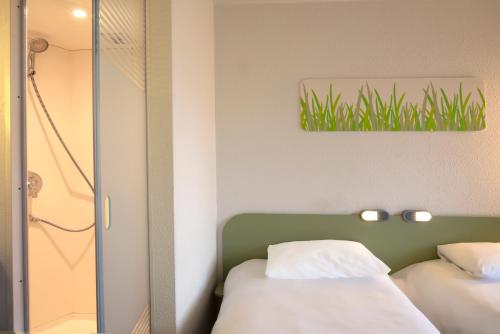 Habitación Doble con 2 camas individuales del hotel Ibis Budget Antwerpen Port. Foto 8