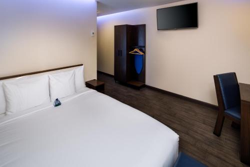 Habitación adaptada para personas con movilidad reducida - Cama grande del hotel Orchard Street Hotel. Foto 2