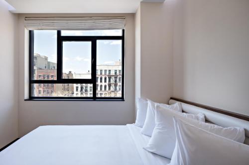 Habitación Orchard Queen con cama grande del hotel Orchard Street Hotel