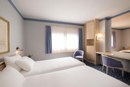 Habitación Doble con cama supletoria del hotel Exe Boston