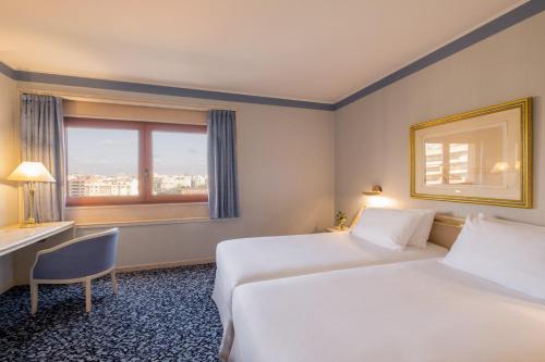 Habitación Doble con sala de estar - 1 o 2 camas del hotel Exe Boston. Foto 1