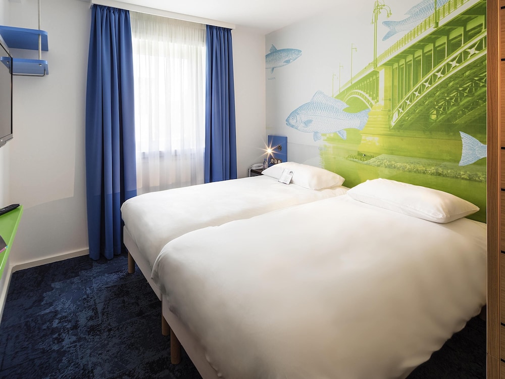Habitación estándar con dos camas individuales del hotel Ibis Styles Strasbourg Avenue Du Rhin. Foto 3