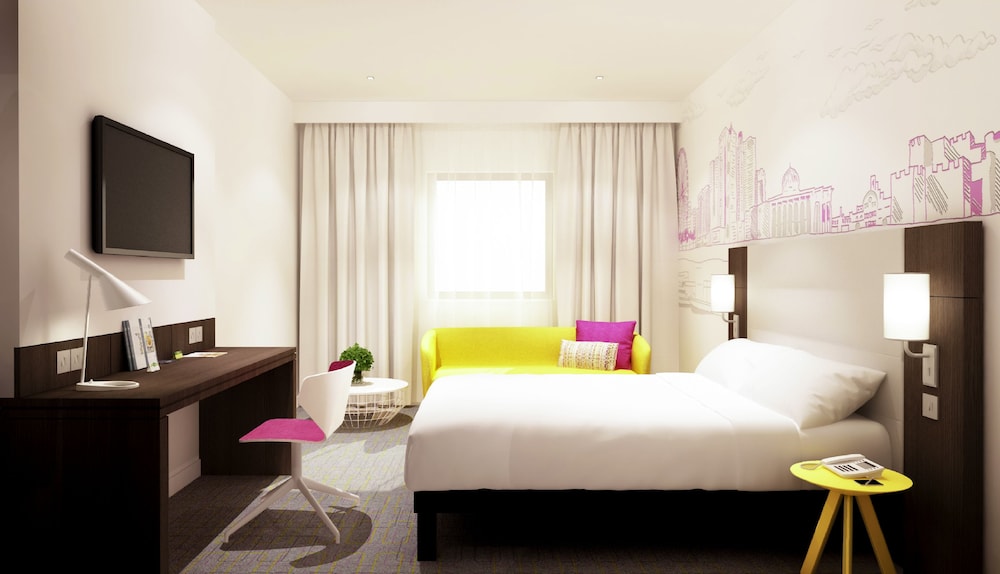 Habitación Clásica con 1 cama queen size del hotel Ibis Styles Sharjah. Foto 6