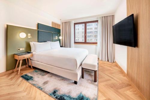 Residencia Grand - 1 cama extragrande del hotel Hilton Berlin. Foto 1