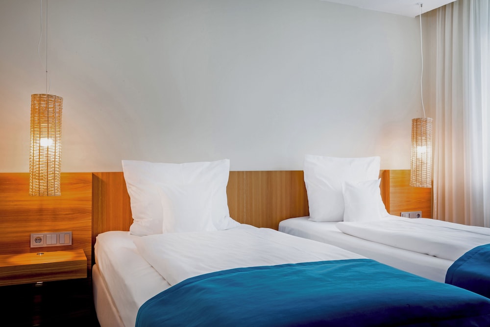 Habitación con 2 camas individuales del hotel Lindner Hotel Berlin Ku'damm. Foto 3