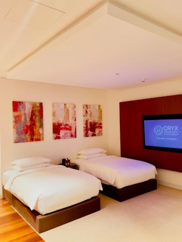 Suite Lujo 1 Cama queen 2 Camas individuales del hotel Oryx Airport