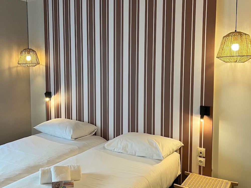 Habitación Estándar 2 Camas Individuales del hotel Ibis Styles Nimes Gare Centre. Foto 4