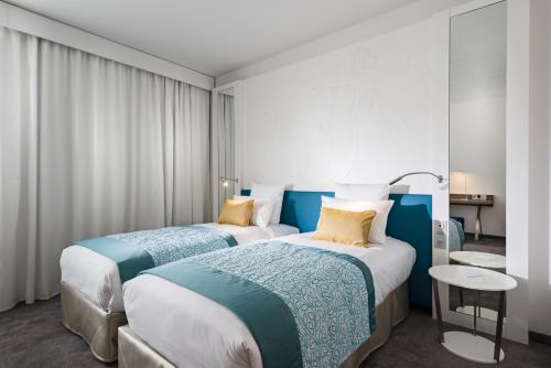 Habitación Doble Estándar - 2 camas del hotel Golden Tulip Marseille Euromed. Foto 2