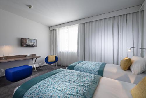 Habitación Doble Estándar - 2 camas del hotel Golden Tulip Marseille Euromed. Foto 3