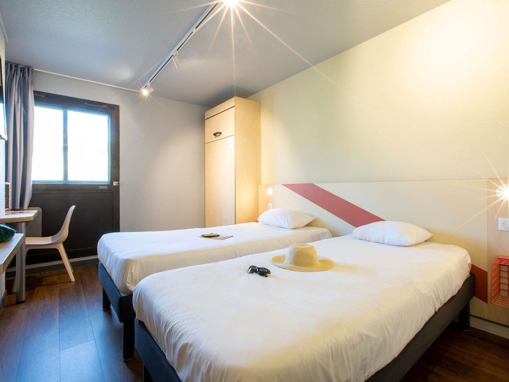 Habitación Triple con 3 camas individuales del hotel Ibis Budget Avignon Centre