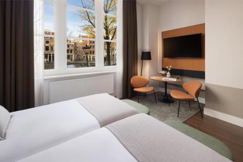 Habitación Superior con vistas al canal del hotel Nh City Centre Amsterdam