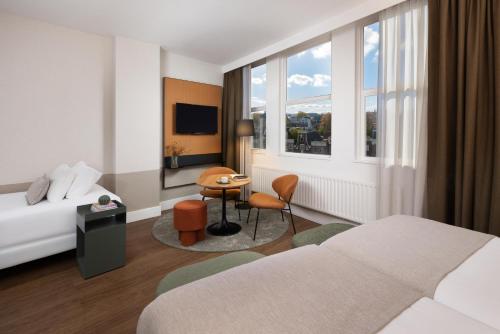 Habitación Triple Estándar del hotel Nh City Centre Amsterdam. Foto 3