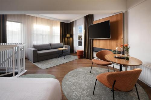 Habitación familiar cuádruple con vistas del hotel Nh City Centre Amsterdam. Foto 4