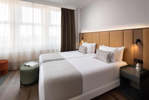 Habitación Cuádruple Familiar del hotel Nh City Centre Amsterdam. Foto 3
