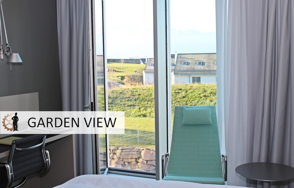 Habitación Deluxe, 2 camas individuales, vistas al jardín del hotel Modern Times. Foto 7