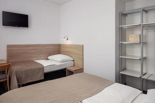 Habitación Doble Estándar con cama supletoria del hotel Ambiance. Foto 7