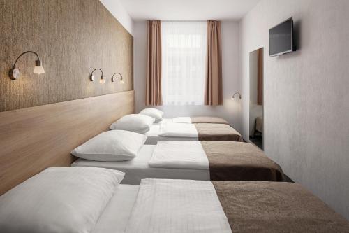 Habitación Triple Estándar con cama supletoria del hotel Ambiance. Foto 3