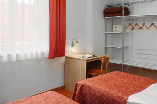 Habitación Triple Estándar con cama supletoria del hotel Ambiance. Foto 3