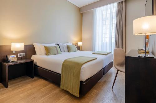 Habitación Doble con vistas a la ciudad del hotel TURIM Aveiro Palace. Foto 1