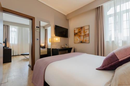 Suite con vistas a la ciudad del hotel TURIM Aveiro Palace. Foto 6