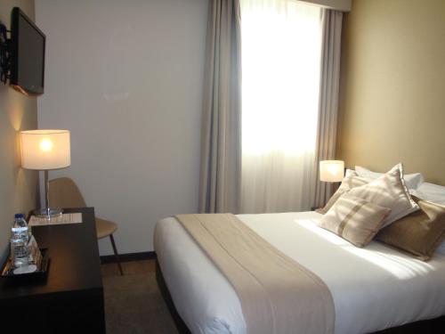 Habitación Doble con vistas a la ciudad del hotel TURIM Aveiro Palace. Foto 4