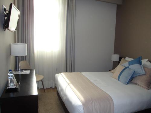 Habitación Doble con vistas a la ciudad del hotel TURIM Aveiro Palace. Foto 5