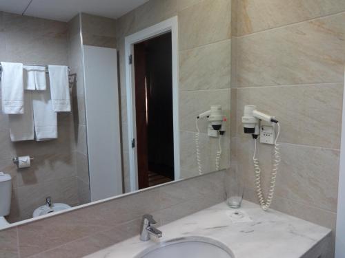 Habitación Triple del hotel Windsor. Foto 1
