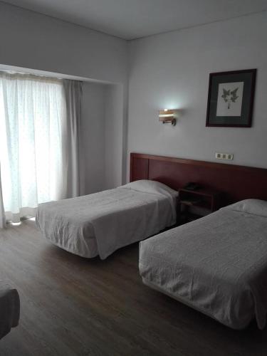 Habitación Doble - 2 camas del hotel Residencial Greco. Foto 3