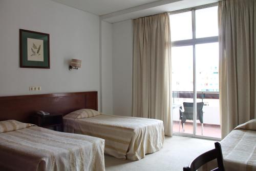 Habitación Triple del hotel Residencial Greco