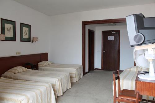 Habitación Triple del hotel Residencial Greco. Foto 1