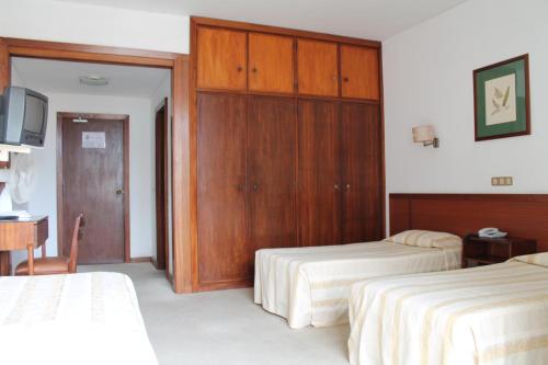 Habitación Triple del hotel Residencial Greco. Foto 2